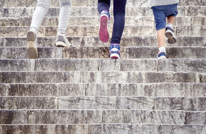 Children's feet climbing steps