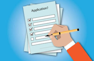 a person filling a form