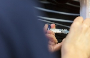 nurse administering an injection