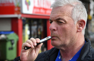 A man using an e-cigarette.