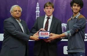 The British Deputy High Commissioner Richard Crowder giving award to the winner