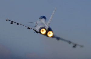 A Typhoon F2 fighter jet pilot from 29 Squadron applies the afterburners as the aircraft takes off from RAF Coningsby. Crown copyright.