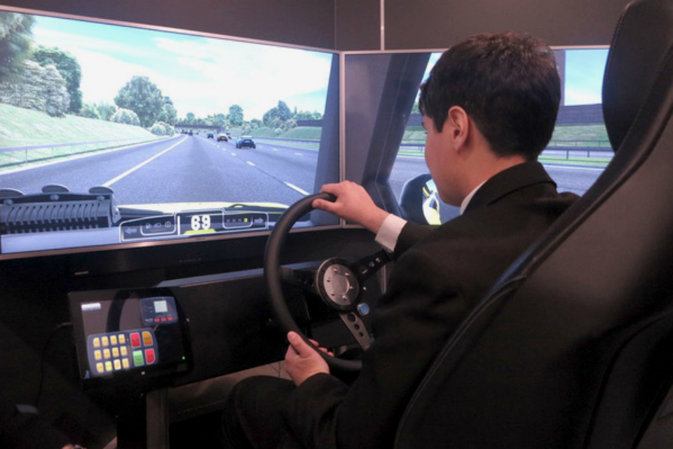 Image showing a Big Bang Fair visitor using the Highways England simulator