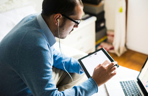 Man browsing on digital device. Via Eugenio Marongiu at Shutterstock.