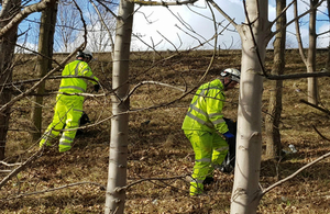 Traffic operatives clearing litter