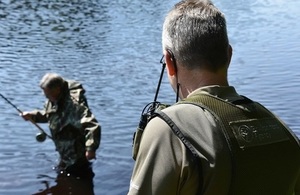 Images shows fisheries enforcement officer on patrol