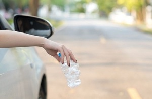 Litter being dropped from a car