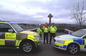 Traffic officers and police with hi-vis cars