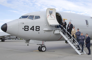 Defence delegates boarding a P8-A Poseidon at RAF Lossiemouth