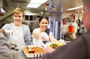 Young people serving food