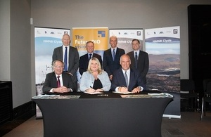 DIO Commercial Director Jacqui Rock, Director Navy Support Matt Harrison, Navy Command and the Clyde Commercial Team sign framework agreement.