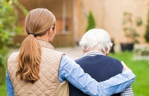 Care home resident accompanied by a carer