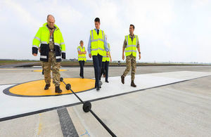 RAF Marham Station Commander, Gp Capt Ian Townsend and team inspecting the Rotary Hydraulic Arrestor Gear on the newly-resurfaced runway.