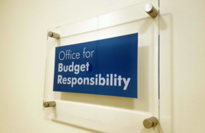 Glass sign on a white wall which reads: Office for Budget Responsibility