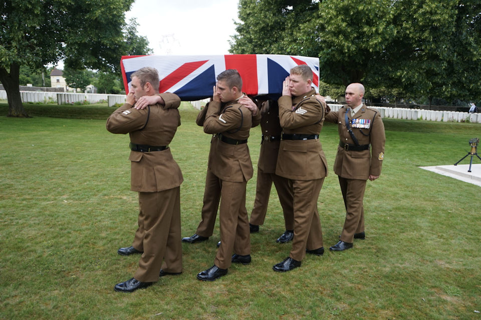 Members of the RTR provide a bearer party for their fallen comrade. Crown Copyright. All rights reserved