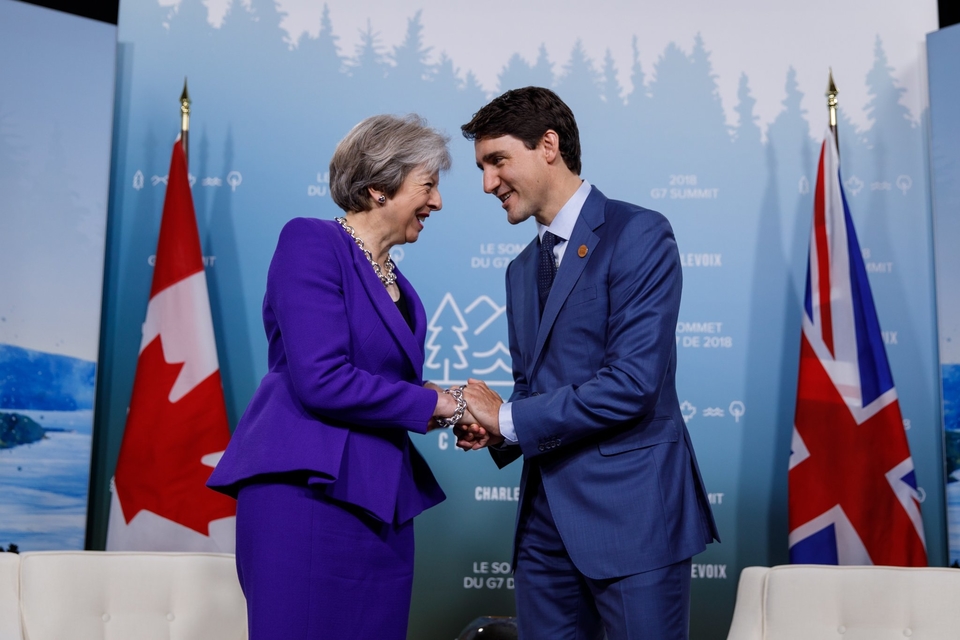 PM May with PM Trudeau Shaking Hands