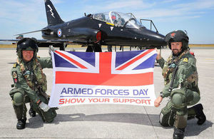 Hawk pilots Lt Nick Weightman (L) and Lt Tom Sawle show their support for Armed Forces Day 2018 at RNAS Culdrose.