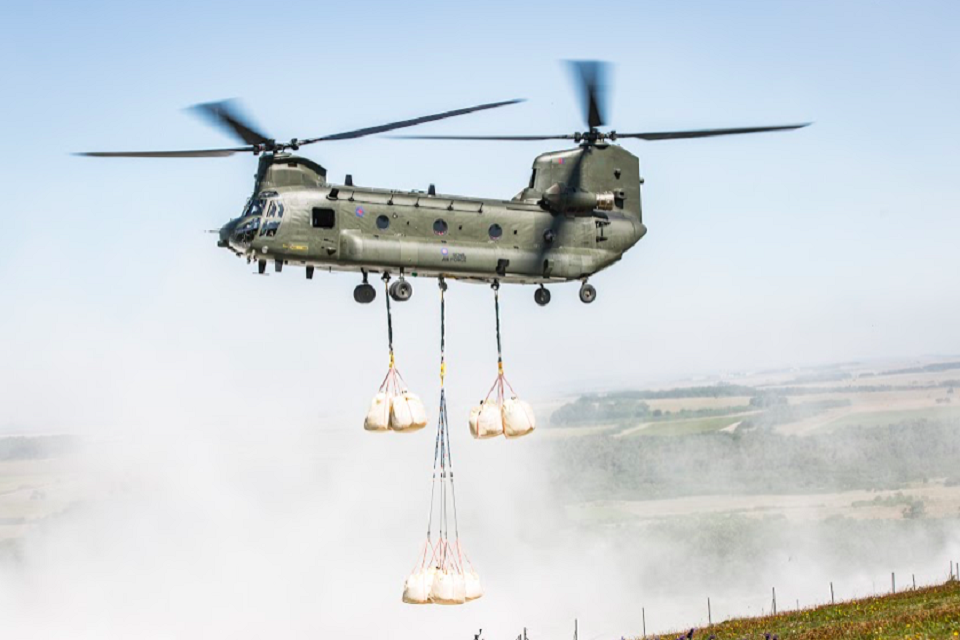 A Chinook delivers bags of chalk to re-chalk the kiwi for the first time in 30 years.