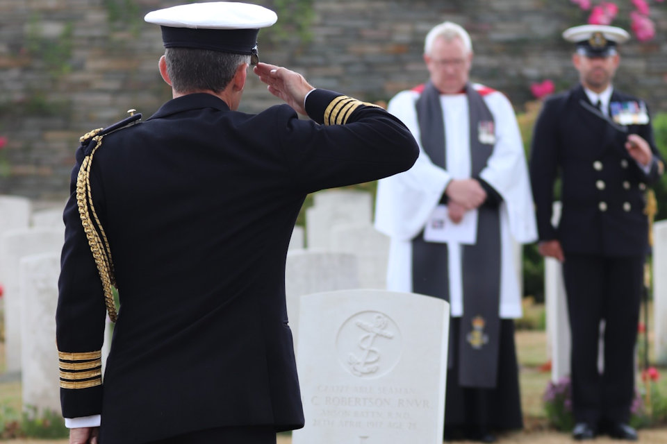 Captain Keri Harris, Naval Attaché to France raises a salute in honour of AB Robertson, Crown Copyright, All rights reserved