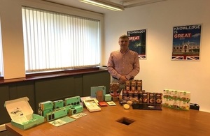 Picture of David Hill, Managing Director at Cocoda in front of a selection of Cocoda products.