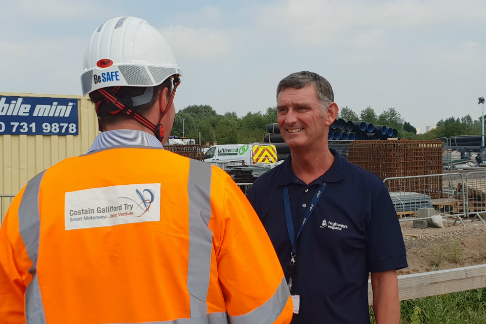 Image showing a picture of Nick Robinson talking to a contractor