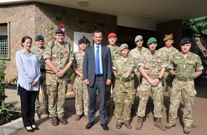 Armed Forces Minister Mark Lancaster in Uganda, flanked by troops who are providing training for the African Union's Mission in Somalia.