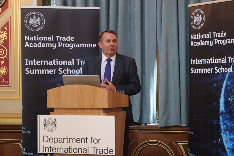 International Trade Secretary Dr Liam Fox speaking at a lectern.