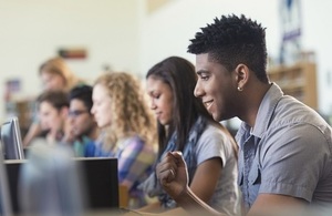 Students looking at computer