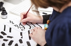 Picture of founder Alison Hardcastle designing a happy birthday card.
