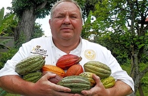 Picture of David Greenwood Haigh holding cacao fruit.