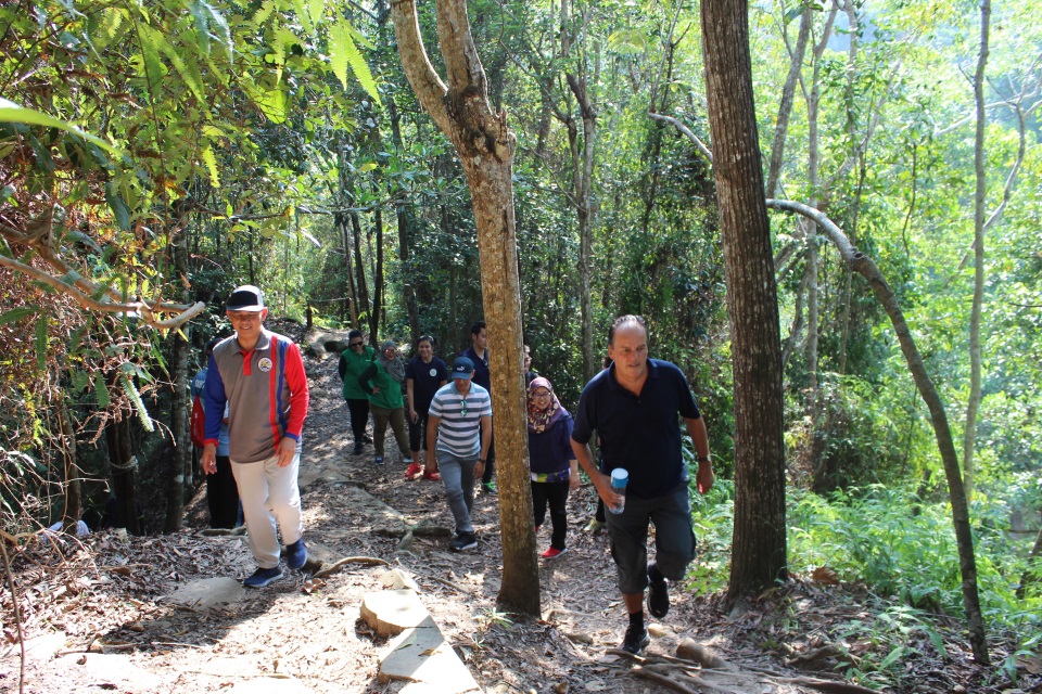 Minister Field with Yang Berhormat Dato Paduka Seri Haji Aminuddin trekking through Tasek Lama