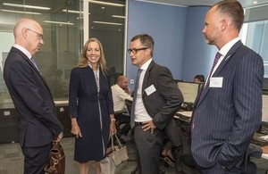 Photo, Baroness Fairhead meets Barclays executives at the launch of the new trade centre.