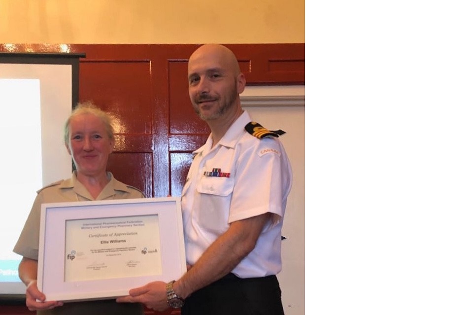 Lt Col Ellie William’s receiving a Certificate of Appreciation from the Federation Internationale Pharmaceutique (FIP).