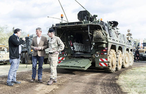 Defence Minister Stuart Andrew speaks to Roddy Malone, Head of Land Concepts and Assessment and Colin McClean, Director Land Equipment. Crown copyright.