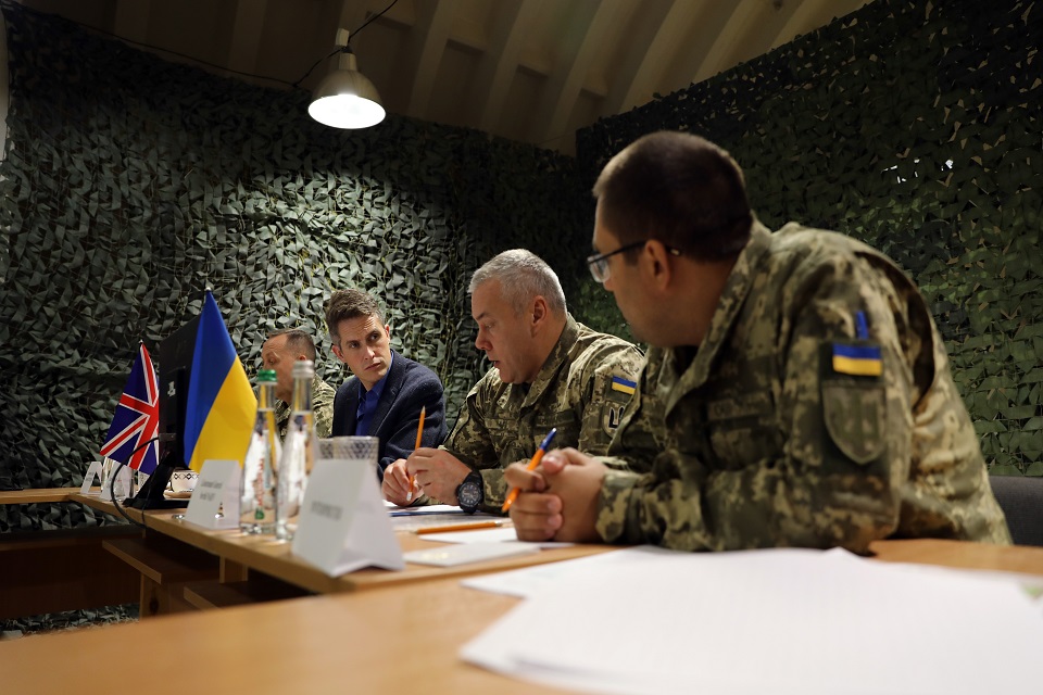 Defence Secretary Gavin Williamson sits around a table with his Ukrainian counterparts.