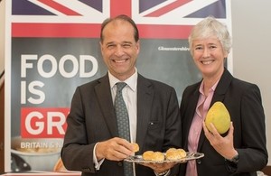 Minister Hollingbery holds a savoury pork moon cake with UK in Taiwan Representative Catherine Nettleton