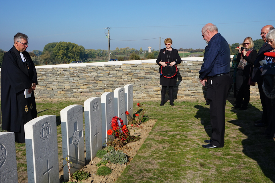 Tony Skilbeck lays a wreath on his grandfather's grave, crown copyright all rights reserved.