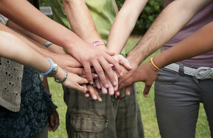 Photo of joined hands in a circle