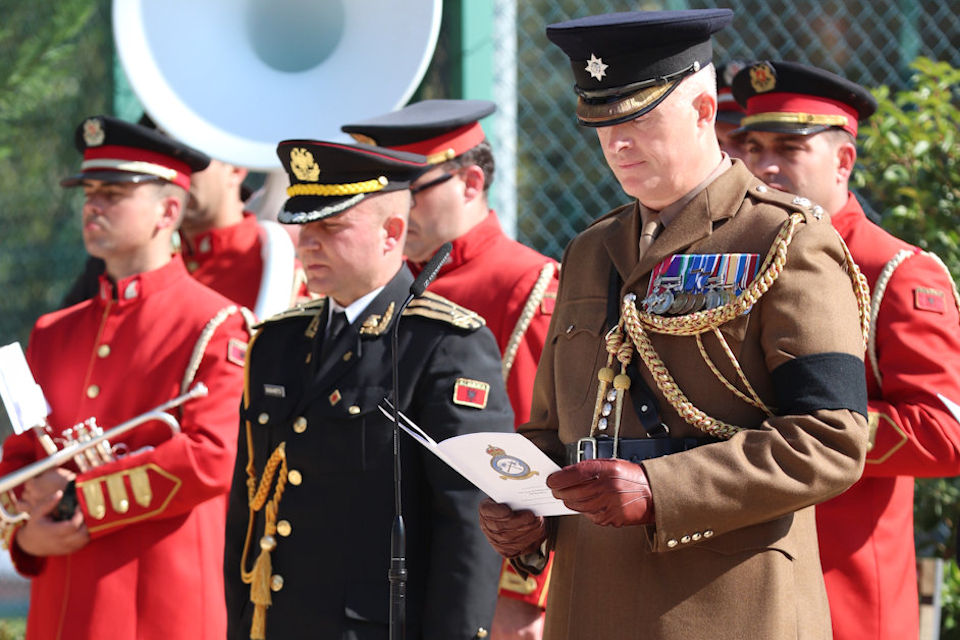 Lt Col Edward Melotte, MBE, Defence Attaché, conducts a reading during the service, Crown Copyright, all rights reserved