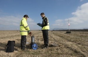 Samples being collected at the Repository by two employees for analysis