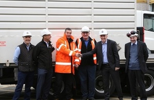 Magnox Managing Director Tony Moore shaking Adrian Owen, Wylfa Transport Manager’s, hand.