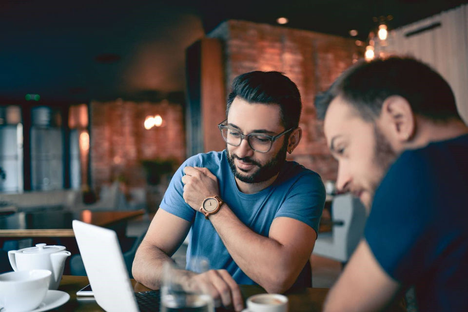 Men looking at laptop