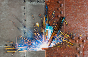 A picture of two metal materials being welded