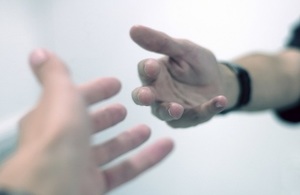 Hands reaching out to each other.