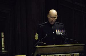 Warrant Officer Class 1, Glenn Haughton, reads during a service at The Royal Hospital Chelsea.