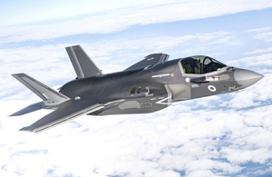 F-35B fighter jet amongst the clouds.