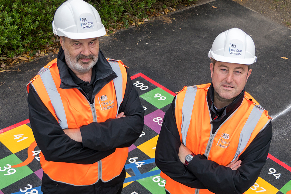 Two project managers from the Coal Authority at the reinstated playground