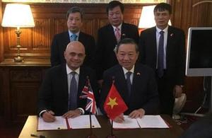 Home Secretary Sajid Javid with Senior Lieutenant General To Lam, the Vietnamese Minister for Public Security.