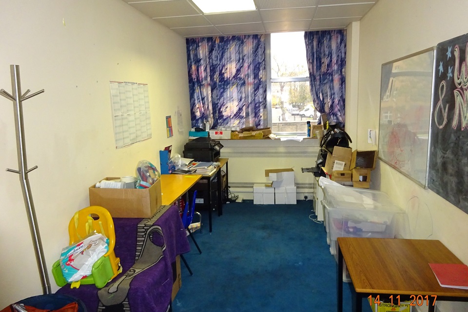 Room in unregistered school, with storage boxes