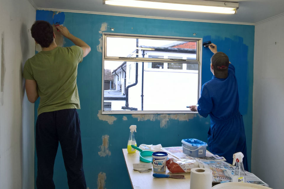 Highways England staff painting the art room